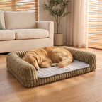 Grey CoolSpot cooling mat inside the Bark Crew sofa bed with a golden retriever